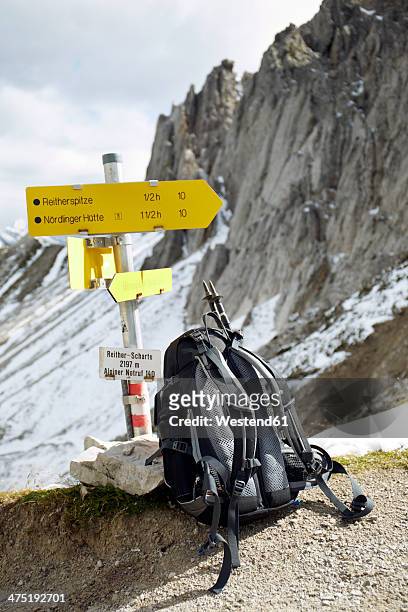 austria, tyrol, karwendel mountains, rucksack under sign post - hiking across the karwendel mountain range stock pictures, royalty-free photos & images