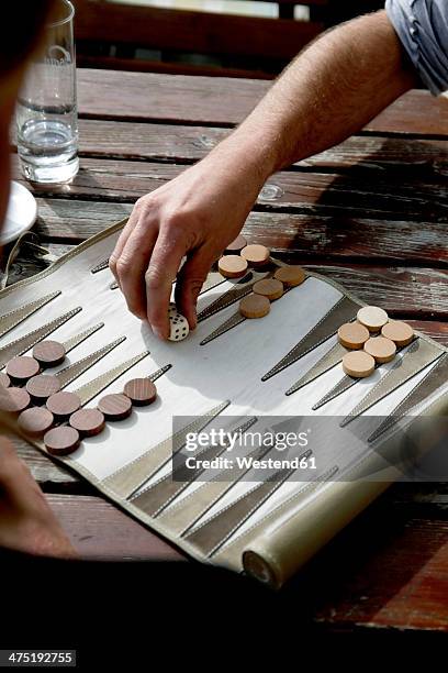 austria, tyrol, men playing backgammon - backgammon stock pictures, royalty-free photos & images