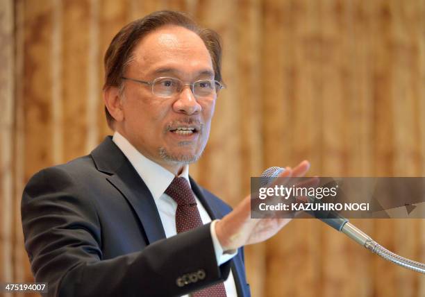 Malaysia's opposition leader Anwar Ibrahim delivers a speech during a lecture hosted by Japan's Sasakawa Peace Foundation in Tokyo on February 27,...