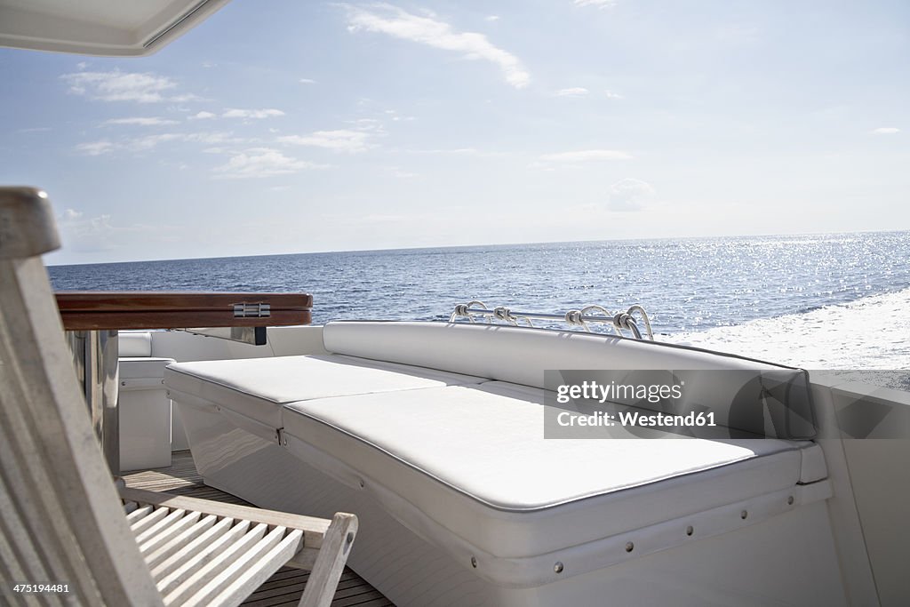 Italy, Sardinia, Chair on yacht deck