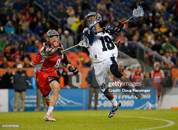 Kyle Harrison of the Ohio Machine takes a shot against Gregory Downing of the Denver Outlaws at Sports Authority Field at Mile High on May 29, 2015...