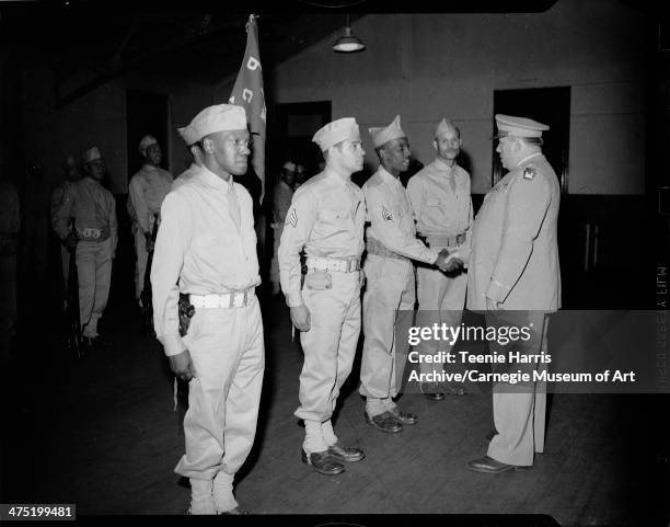 Colonel Francis Fendell of Pennsylvania State Guard shaking hands with man, surrounded by Emery Dukes, John V Smith, and James Johnson, for State...