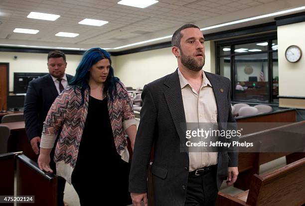 Dustin Diamond, with his fiancee Amanda Schutz and her attorney walk out of the coutroom after a split verdict in an Ozaukee County Courthouse May...
