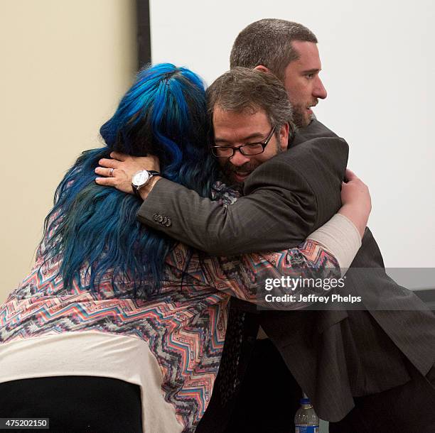 Dustin Diamond, with fiancee Amanda Schutz, and his attorney react after the reading of a split verdict in an Ozaukee County Courthouse May 29, 2015...