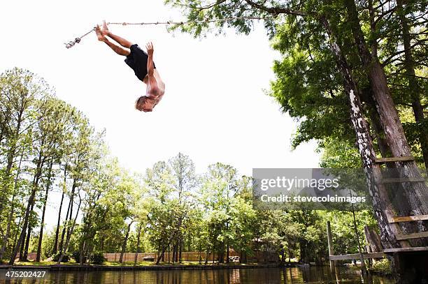 rope swinging - rope swing stock pictures, royalty-free photos & images