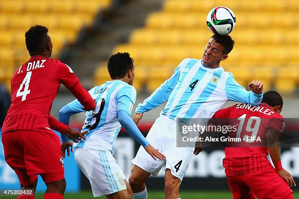 Nicolas Tripichio of Argentina jumps for a header with Jesus Gonzalez of Panama during the FIFA U-20 World Cup New Zealand 2015 Group B match between...