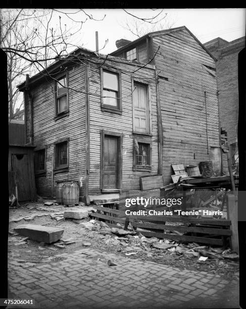 Condemned frame home of Hattie Dodson and Mary Davenport, with door on second story, bulging wall, and outhouse on left , Hill District, Pittsburgh,...