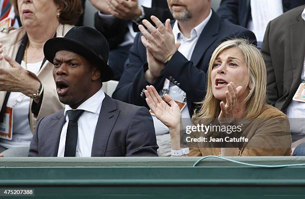 Sylvain Wiltord and Michele Laroque attend day 6 of the French Open 2015 at Roland Garros stadium on May 29, 2015 in Paris, France.