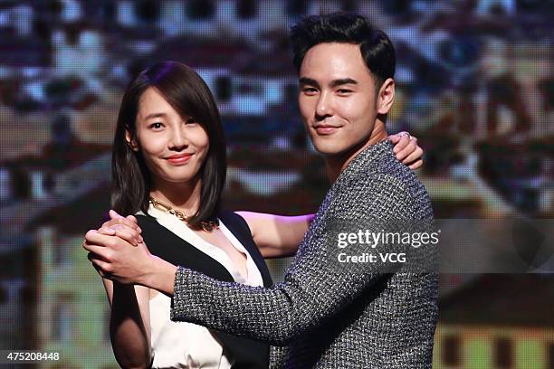 Model and actor Ethan Ruan and actress Bai Baihe attend film "The Cities In Love" press conference on May 29, 2015 in Beijing, China.