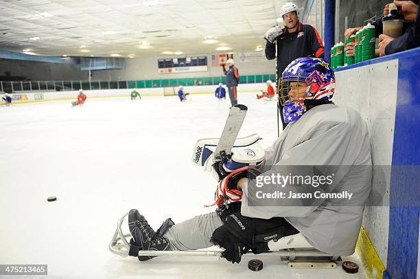 Paralympic Sled Hockey Team goalie, Jen Yung Lee, waits to take his place in the net during practice at the Sertich Ice Arena on February 26, 2014 in...