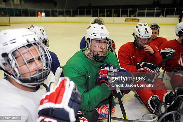 Paralympic Sled Hockey Team athlete, Brody Roybal , listens to Assistant Coach Guy Gosselin during practice at the Sertich Ice Arena on February 26,...