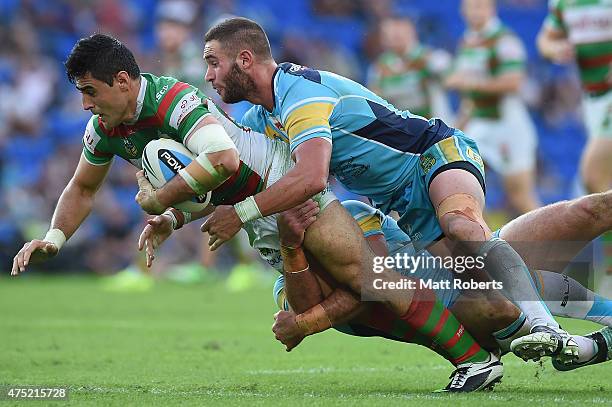 Bryson Goodwin of the Rabbitohs is tackled during the round 12 NRL match between the Gold Coast Titans and the South Sydney Rabbitohs at Cbus Super...
