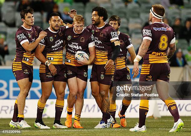 Broncos celebrate after Jack Reed of the Broncos scored a try during the round 12 NRL match between the Canberra Raiders and the Brisbane Broncos at...