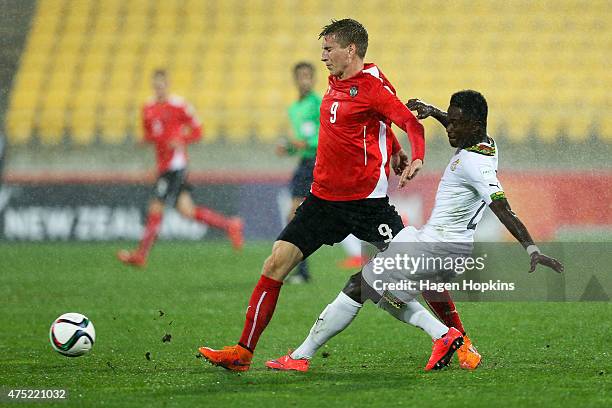 Valentin Grubeck of Austria is challenged by Emmanuel Ntim of Ghana during the Group B FIFA U-20 World Cup New Zealand 2015 match between Ghana and...