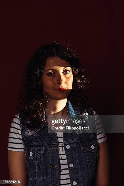 beautiful young woman looking through window - sun rays through window bildbanksfoton och bilder