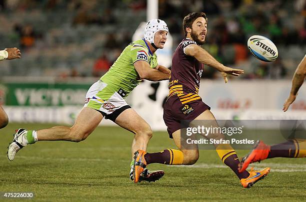 Ben Hunt of the Broncos passes the ball during the round 12 NRL match between the Canberra Raiders and the Brisbane Broncos at GIO Stadium on May 30,...