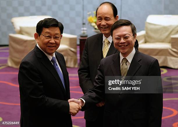 Chen Deming , President of China's Association for Relations Across the Taiwan Straits, is greeted by Wang Yu-chi, minister of Taiwan's Mainland...