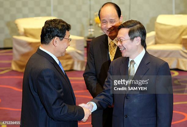Chen Deming , President of China's Association for Relations Across the Taiwan Straits, is greeted by Wang Yu-chi, minister of Taiwan's Mainland...
