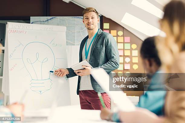 creative startup business presentation. - man flipchart stock pictures, royalty-free photos & images