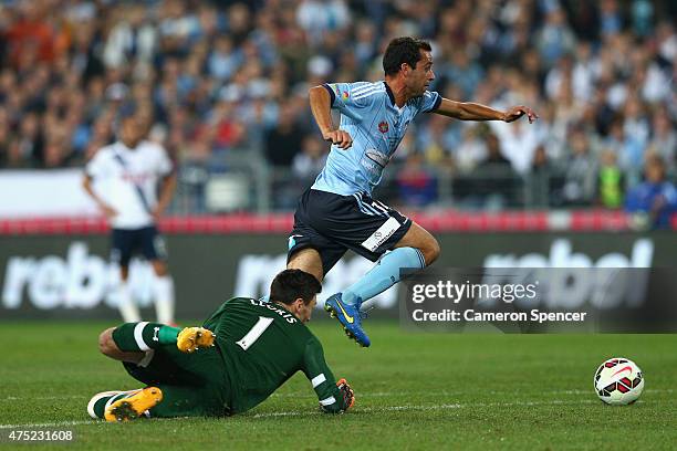 Alex Brosque of Sydney FC dribbles the ball past Hugo Lloris of Hotspurs during the international friendly match between Sydney FC and Tottenham...