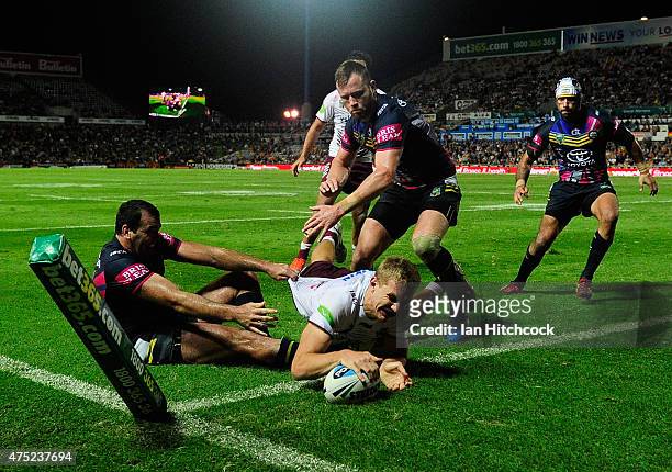 Tom Trbojevic of the Sea Eagles scores a try during the round 12 NRL match between the North Queensland Cowboys and the Manly Sea Eagles at...