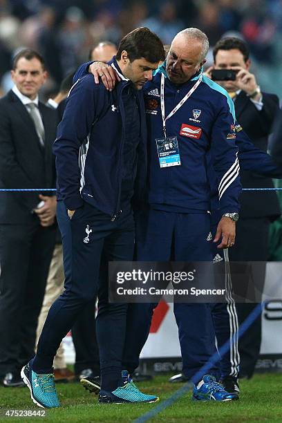 Sydney FC coach Graham Arnold embraces Hotspurs coach Mauricio Pochettino following the international friendly match between Sydney FC and Tottenham...