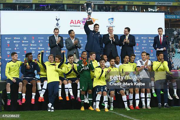 Tottenham Hotspur celebrate with the AIA Cup after victory during the international friendly match between Sydney FC and Tottenham Spurs at ANZ...