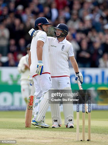 England batsman Alastair Cook is congratulated by Adam Lyth after he becomes the hightest test run scorer for England during day two of the 2nd...