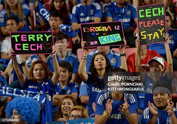 Chelsea football fans cheer their team during the friendly match with Thailand All-Stars at Rajamangala Stadium in Bangkok on May 30, 2015. AFP PHOTO...