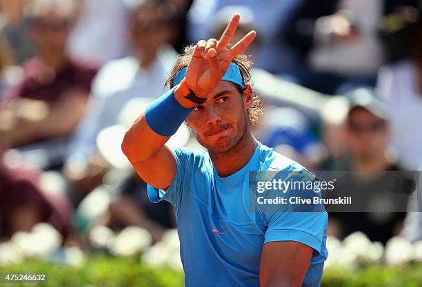 Rafael Nadal of Spain gestures in his Men's Singles match against Andrey Kuznetsov of Russia on day seven of the 2015 French Open at Roland Garros on...