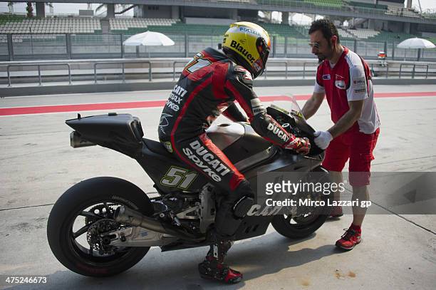 Michele Pirro of Italy and Ducati Test Team returns in box during the MotoGP Tests in Sepang - Day Two at Sepang Circuit on February 27, 2014 in...