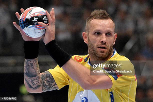 Grzegorz Tkaczyk of Kielce controls the ball during the "VELUX EHF FINAL4" semi final match FC Barcelona and KS Vive Tauron Kielce at Lanxess Arena...