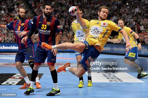 Mateusz Jachlewski of Kielce throws the ball during the "VELUX EHF FINAL4" semi final match FC Barcelona and KS Vive Tauron Kielce at Lanxess Arena...