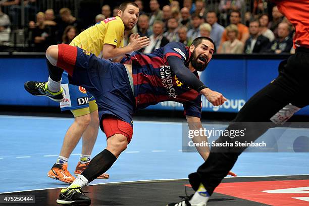 Nikola Karabatic of Barcelona throws the ball during the "VELUX EHF FINAL4" semi final match FC Barcelona and KS Vive Tauron Kielce at Lanxess Arena...