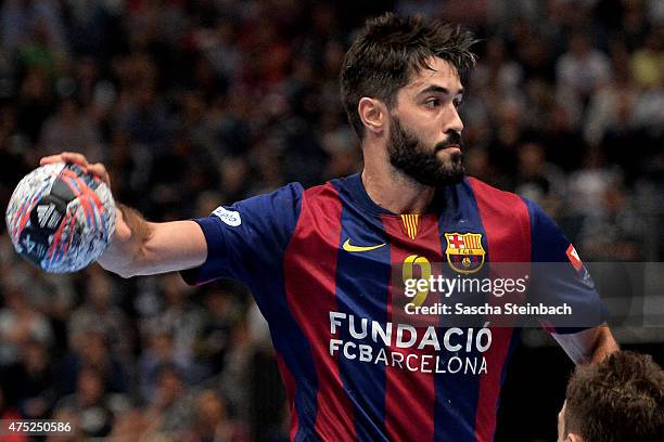 Raul Entrerrios Rodriguez of Barcelona throws the ball during the "VELUX EHF FINAL4" semi final match FC Barcelona and KS Vive Tauron Kielce at...
