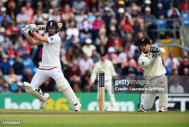 Adam Lyth of England smashes the ball to the boundary in front of Luke Ronchi of New Zealand during day two of the 2nd Investec Test Match between...