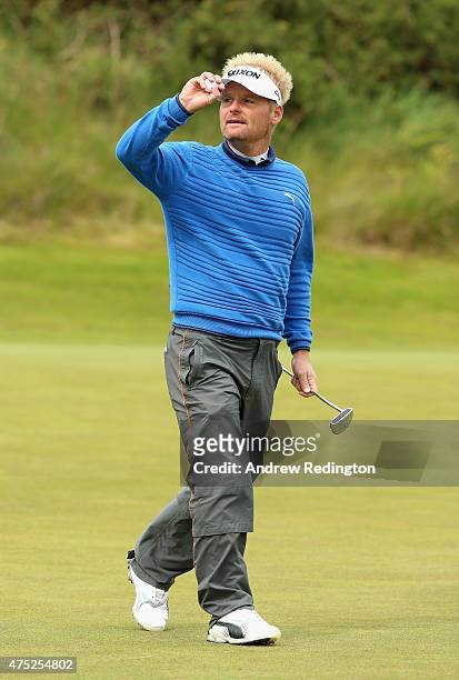 Soren Kjeldsen of Denmark reacts on the13th green during the Third Round of the Dubai Duty Free Irish Open Hosted by the Rory Foundation at Royal...