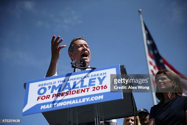 Former Maryland Gov. Martin O'Malley speaks as his wife Katie looks on during an event to announce his candidacy for a presidential campaign May 30,...
