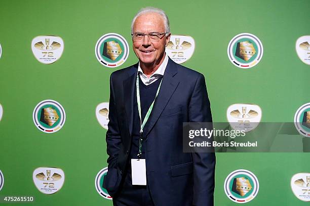 Franz Beckenbauer poses for a photo at the green carpet prior to the DFB Cup Final between Borussia Dortmund and VfL Wolfsburg at Olympiastadion on...