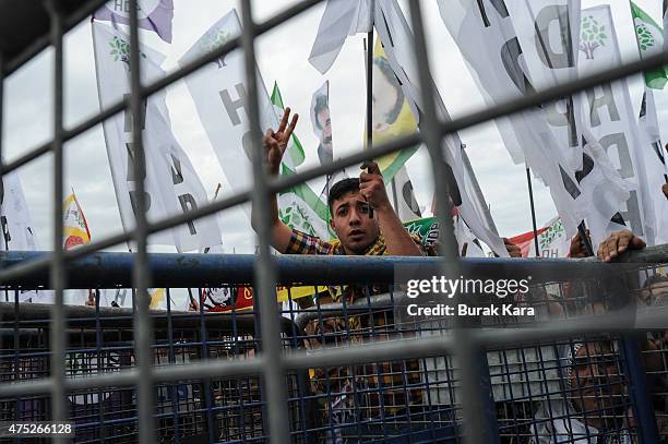 Supporters of Selahattin Demirtas, co-chairman of the pro-Kurdish People's Democratic Party , attend an election rally ahead of Turkey's June 7...