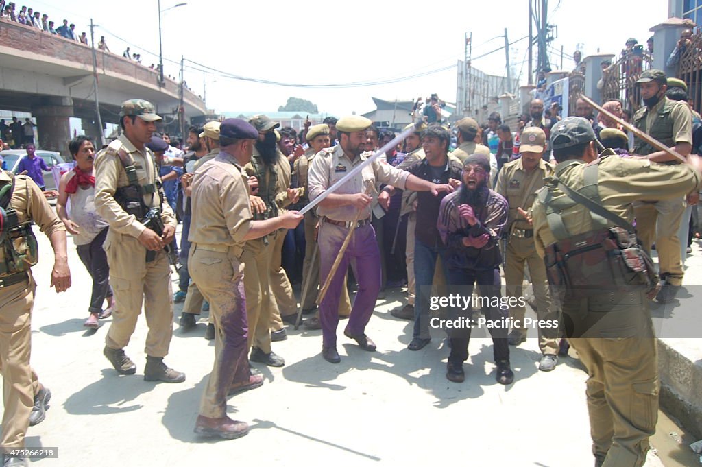 India Kashmiri government employees shout slogans during...