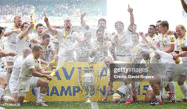 Saracens players celebrate with the Aviva Premiership trophy following their team's 28-16 victory during the Aviva Premiership Final between Bath...