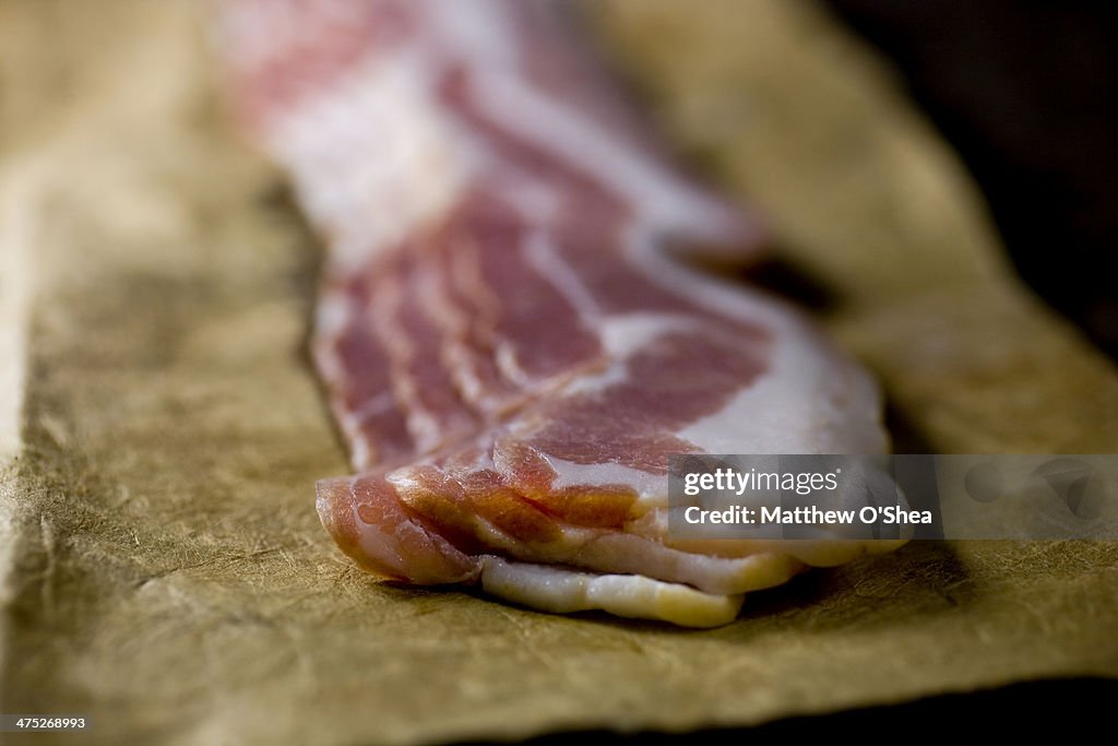 Raw bacon in butcher's paper
