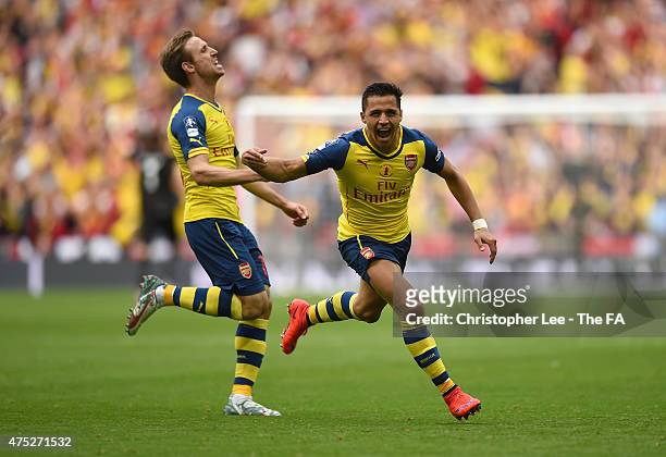 Alexis Sanchez of Arsenal celebrates with his team-mate Nacho Monreal after scoring their second goal during the FA Cup Final between Aston Villa and...