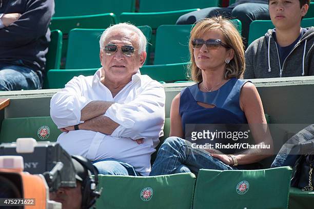Dominique Strauss Kahn and Myriam L'Aouffir attend the French Open 2015 at Roland Garros on May 30, 2015 in Paris, France.