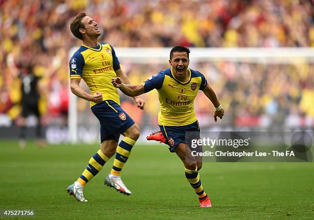 Alexis Sanchez of Arsenal celebrates with his team-mate Nacho Monreal after scoring their second goal during the FA Cup Final between Aston Villa and...