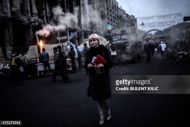 Woman walks on Kiev's Independence square on February 27, 2014. Deposed Ukrainian president Viktor Yanukovych the same day said he still considers...