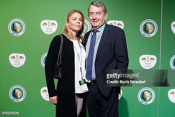 President Wolfgang Niersbach and his girlfriend Marion Popp pose for a photo at the green carpet prior to the DFB Cup Final between Borussia Dortmund...