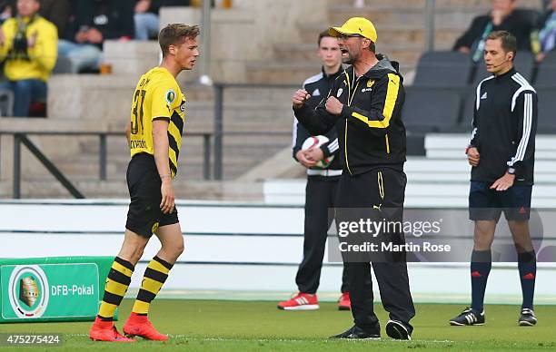 Head coach Juergen Klopp of Dortmund celebrates after Pierre-Emerick Aubameyang of Borussia Dortmund scored his teams first goal during the DFB Cup...