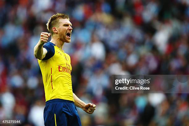 Per Mertesacker of Arsenal celebrates victory after the FA Cup Final between Aston Villa and Arsenal at Wembley Stadium on May 30, 2015 in London,...